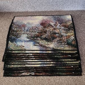 12 pieces of Thomas Kinkade Winter Scene Placemats Set with Blue and Green Hues.